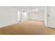 Expansive living area featuring neutral carpet, doors, and lots of potential at 1111 Clairemont Ave # J6, Decatur, GA 30030