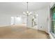 Open living space with dining area, window, and view into the kitchen at 1111 Clairemont Ave # J6, Decatur, GA 30030