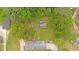 Overhead aerial view of a home and detached shed on a wooded lot at 115 Pine Tree Dr, Fayetteville, GA 30214