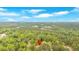 Aerial view of a neighborhood and wooded area with a pin marking property at 115 Pine Tree Dr, Fayetteville, GA 30214