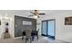 Cozy dining room with gray accent wall, seating for four, and sliding glass doors at 115 Pine Tree Dr, Fayetteville, GA 30214