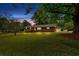 A charming one-story house with a lush green lawn at 115 Pine Tree Dr, Fayetteville, GA 30214