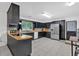 Modern kitchen featuring black cabinetry, stainless steel appliances, and tiled backsplash at 115 Pine Tree Dr, Fayetteville, GA 30214
