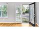 View from living room to the outside balcony through glass door at 1150 Collier Nw Rd # 1N, Atlanta, GA 30318