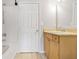 Bathroom featuring shower/tub combo, vanity with storage, mirror and white door at 1150 Collier Nw Rd # 1N, Atlanta, GA 30318