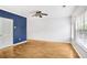 Inviting bedroom with hardwood floors and a modern blue accent wall at 1150 Collier Nw Rd # 1N, Atlanta, GA 30318