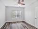 Bedroom features hard surface floors, ceiling fan and a large window at 1150 Collier Nw Rd # 1N, Atlanta, GA 30318