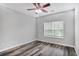 Bedroom features hard surface floors, ceiling fan and a large window at 1150 Collier Nw Rd # 1N, Atlanta, GA 30318