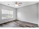 Bedroom features hard surface floors, ceiling fan and a large window at 1150 Collier Nw Rd # 1N, Atlanta, GA 30318