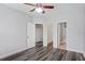 Spacious bedroom with hard surface floors and doorways to storage and bathroom at 1150 Collier Nw Rd # 1N, Atlanta, GA 30318