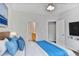 Calm main bedroom with plush bedding and access to an en-suite bathroom at 1150 Collier Nw Rd # 1N, Atlanta, GA 30318