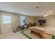 This finished basement features recessed lighting, carpet, and an exercise machine at 1180 Oxford Dr, Conyers, GA 30013
