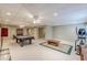 This finished basement features recessed lighting, carpet, and a pool table at 1180 Oxford Dr, Conyers, GA 30013