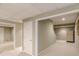 The finished basement has carpet and access to multiple storage rooms at 1180 Oxford Dr, Conyers, GA 30013