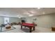 This finished basement features recessed lighting, carpet, a pool table, and an exercise machine at 1180 Oxford Dr, Conyers, GA 30013