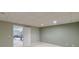 A large basement offers potential living space and recreation with painted walls and a carpeted floor at 1180 Oxford Dr, Conyers, GA 30013