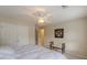 This bedroom has a ceiling fan, carpet, and a closet at 1180 Oxford Dr, Conyers, GA 30013