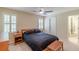 Cozy bedroom with a queen bed, plantation shutters, and neutral-toned walls, offering a relaxing atmosphere at 1180 Oxford Dr, Conyers, GA 30013