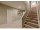 This hallway has carpet and a staircase at 1180 Oxford Dr, Conyers, GA 30013