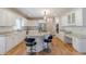 Spacious kitchen featuring white cabinets, stainless steel appliances, and granite countertops at 1180 Oxford Dr, Conyers, GA 30013