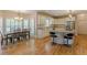 Well-lit kitchen with white cabinets, stainless steel appliances, and an island with barstool seating at 1180 Oxford Dr, Conyers, GA 30013