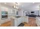 Stylish kitchen with a central island, modern appliances, and an open view to the living space at 1180 Oxford Dr, Conyers, GA 30013