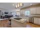 Bright kitchen with stainless steel appliances, granite counters, and an open layout to the living area at 1180 Oxford Dr, Conyers, GA 30013