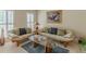 Cozy living room with comfortable seating, a glass coffee table, and natural light at 1180 Oxford Dr, Conyers, GA 30013