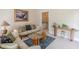 Cozy living room with neutral tones, plush sofas, and a unique glass coffee table at 1180 Oxford Dr, Conyers, GA 30013