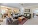 Open-concept living room seamlessly connects to kitchen and dining area with multiple sofas at 1180 Oxford Dr, Conyers, GA 30013