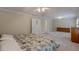 Large main bedroom with vaulted ceilings, neutral carpet, and two doorway entrances at 1180 Oxford Dr, Conyers, GA 30013