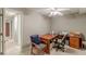 Home office area featuring a ceiling fan, built-in storage, and carpeted floors for a comfortable workspace at 1180 Oxford Dr, Conyers, GA 30013