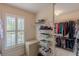 Organized walk-in closet with custom shelving and a window for natural light at 1180 Oxford Dr, Conyers, GA 30013