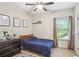 Comfortable bedroom with a navy bed, dresser, and a view to the outdoors at 425 Hunt Ne St, Marietta, GA 30060