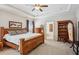 Bedroom with tray ceiling, wooden bed frame, and book shelf at 425 Hunt Ne St, Marietta, GA 30060