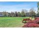 Community green space with a wooden bench and gazebo at 425 Hunt Ne St, Marietta, GA 30060