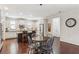 Bright eat-in kitchen with white cabinets, stainless steel appliances, dark wood island and hardwood floors at 425 Hunt Ne St, Marietta, GA 30060