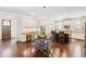 Open eat-in kitchen featuring white cabinets, stainless steel appliances, dark wood island and hardwood floors at 425 Hunt Ne St, Marietta, GA 30060