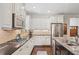Modern kitchen with white cabinets, stainless steel appliances, and granite countertops at 425 Hunt Ne St, Marietta, GA 30060