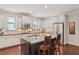 Well-lit kitchen features an island with seating, stainless steel appliances, and abundant cabinet space at 425 Hunt Ne St, Marietta, GA 30060