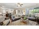 Spacious living room with hardwood floors, bright windows and open floor plan with kitchen views at 425 Hunt Ne St, Marietta, GA 30060