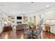 Open concept living room with fireplace, built-in shelves, and view to the kitchen at 425 Hunt Ne St, Marietta, GA 30060