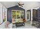 Covered patio with seating, fan, and stylish dark siding at 425 Hunt Ne St, Marietta, GA 30060