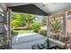 Outdoor patio with comfortable seating and view to backyard with trees and fence at 425 Hunt Ne St, Marietta, GA 30060