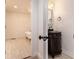 Bathroom with a dark ornate vanity, a mirror, and a claw foot tub on tile flooring at 5035 Villa Rica Hwy, Dallas, GA 30157