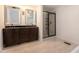 Bathroom featuring double sinks, vanities, and a glass door shower at 5035 Villa Rica Hwy, Dallas, GA 30157