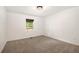 Carpeted bedroom with a window overlooking the yard at 5035 Villa Rica Hwy, Dallas, GA 30157