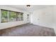 Carpeted bedroom with a large window and white trim at 5035 Villa Rica Hwy, Dallas, GA 30157