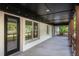 Charming covered patio with string lights and a view of the outdoor scenery at 5035 Villa Rica Hwy, Dallas, GA 30157
