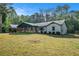 Beautiful exterior view of the home with a metal roof, front porch, and well-maintained lawn at 5035 Villa Rica Hwy, Dallas, GA 30157